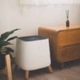 the sqair air purifier next to a wooden cabinet