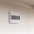 strato ceiling air purifier mounted to a wall