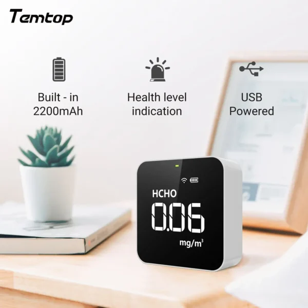 Temtop M10i air quality monitor with accessories including charging cable and manual