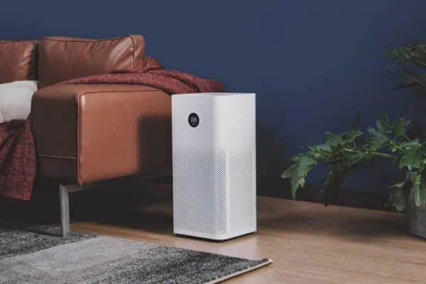 Xiaomi 3H air purifier in a living room with blue walls