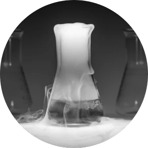 a glass full of chemicals in a lab