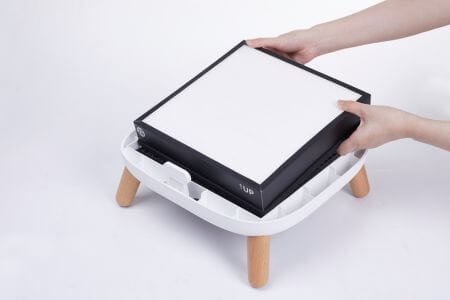 a person inserting a hepa filter into an air purifier