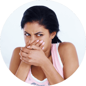 A person covering her nose from bad smells