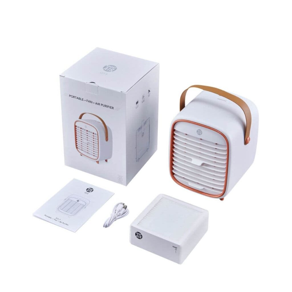 portable air purifier qt3 next to a box with a cable, manual and replacement filter