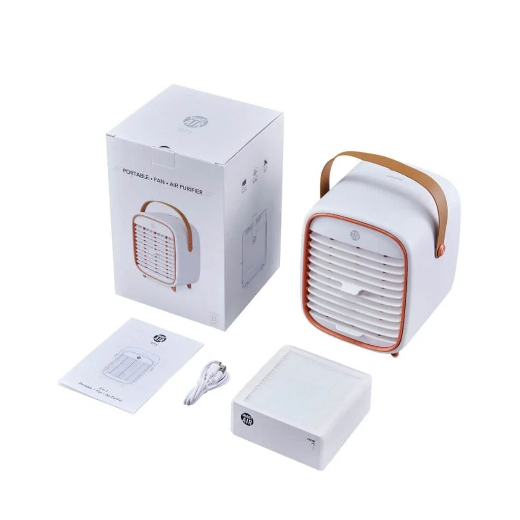 portable air purifier qt3 next to a box with a cable, manual and replacement filter