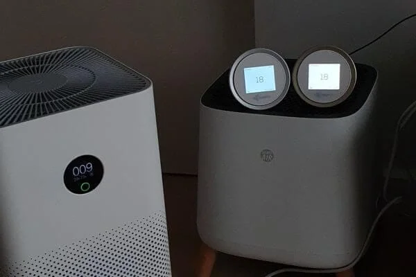 two separate air quality monitors show different readings than the built-in sensor of an air purifier