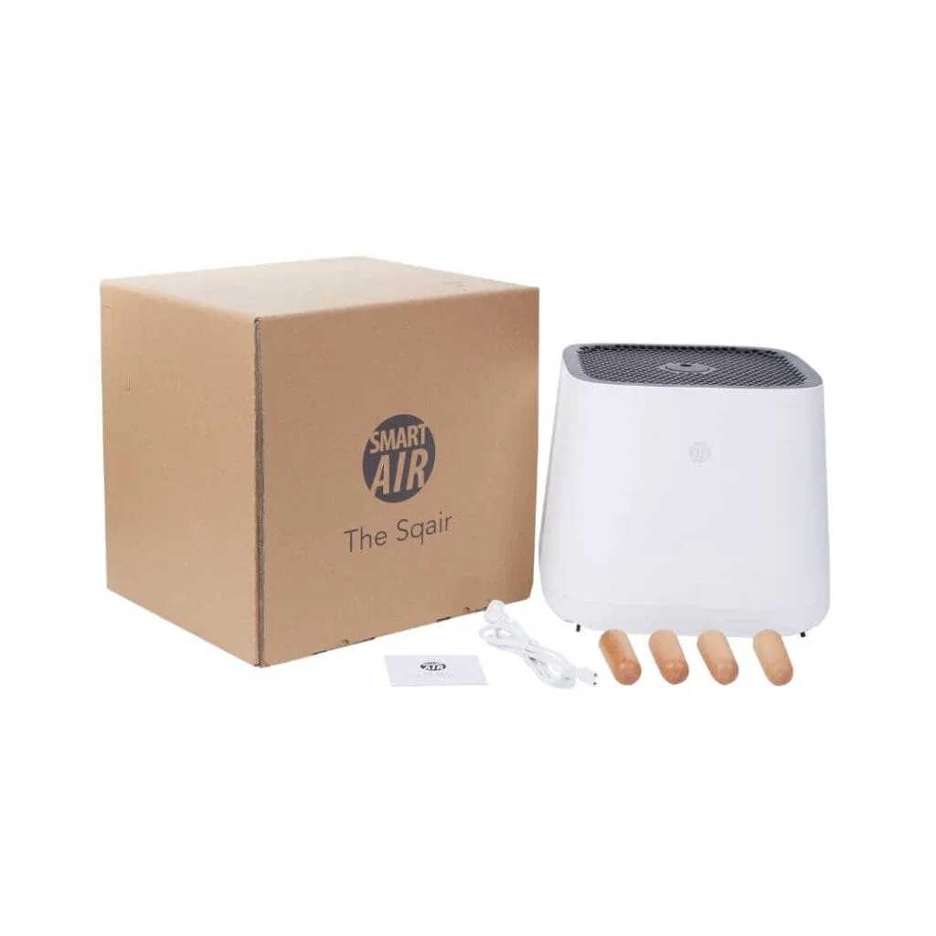 the sqair air purifier next to its cardboard box